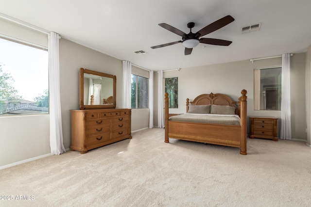 bedroom with light carpet and ceiling fan