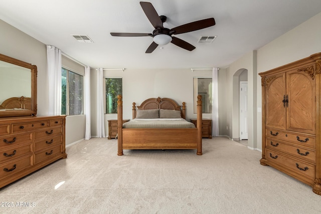 bedroom featuring light carpet and ceiling fan