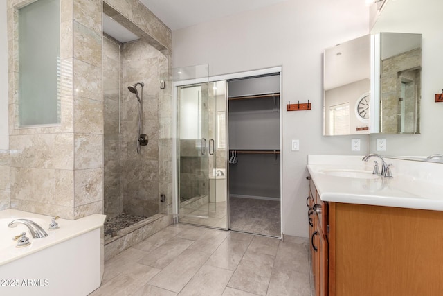 bathroom featuring plus walk in shower and vanity