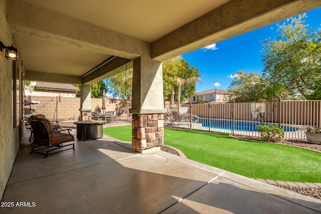 view of patio with a fenced in pool