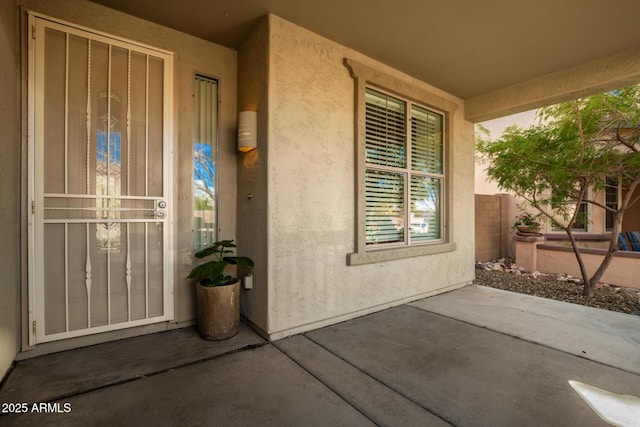 doorway to property featuring a patio