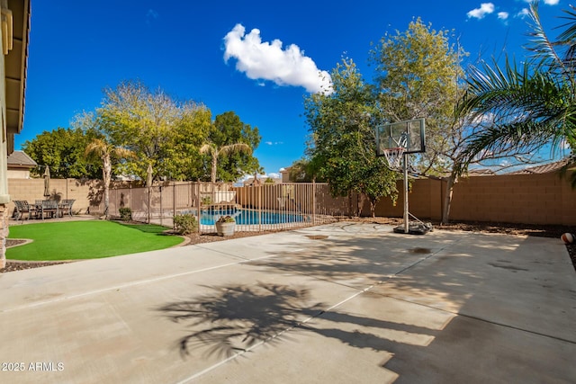 exterior space with a fenced in pool