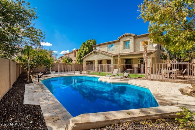 view of swimming pool with a patio area