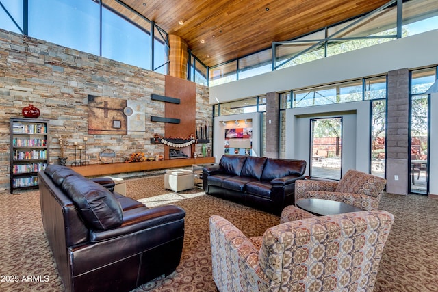 carpeted living room featuring high vaulted ceiling and wooden ceiling