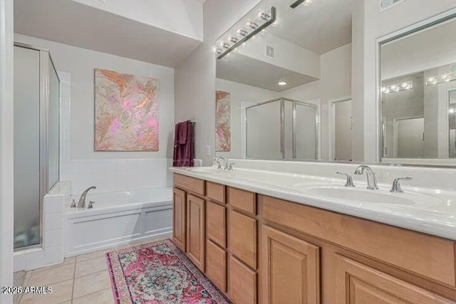 bathroom with vanity, shower with separate bathtub, and tile patterned flooring