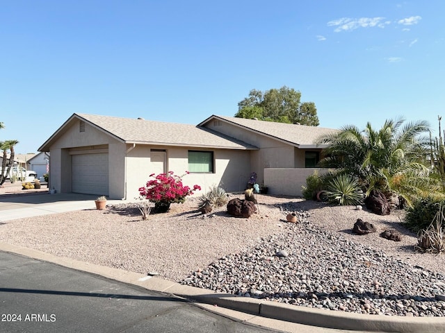 ranch-style house featuring a garage