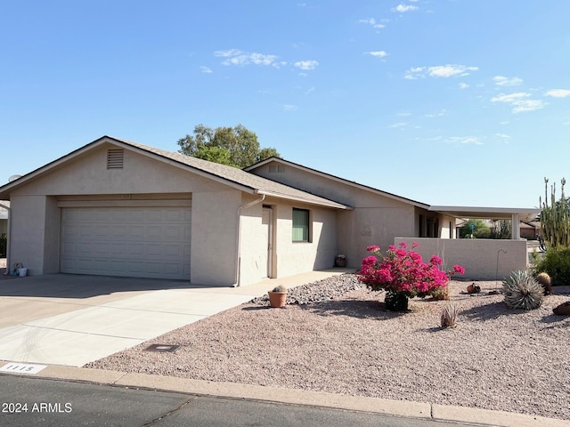 ranch-style house featuring a garage