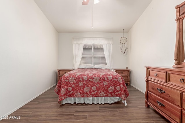 bedroom with dark wood-type flooring and ceiling fan