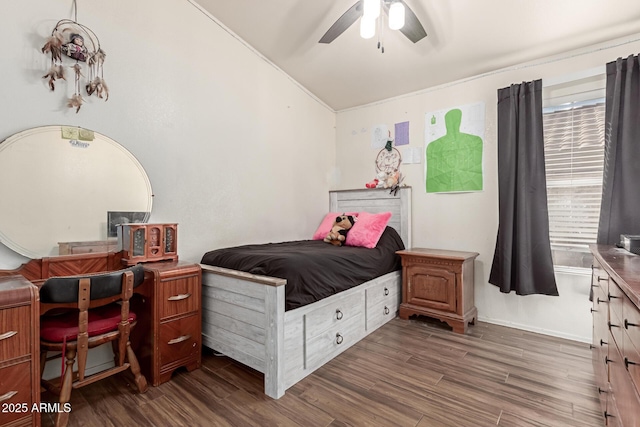 bedroom featuring dark hardwood / wood-style flooring, lofted ceiling, and ceiling fan