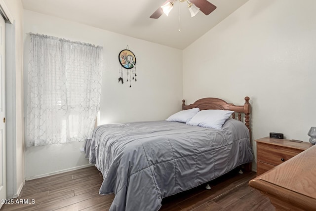 bedroom featuring ceiling fan, lofted ceiling, and dark hardwood / wood-style floors