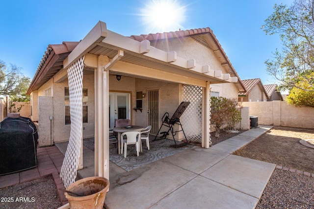 back of property featuring a patio area