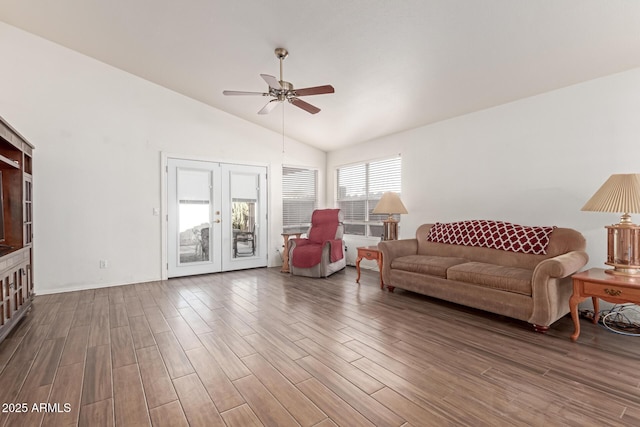 living room featuring french doors, ceiling fan, dark hardwood / wood-style flooring, and high vaulted ceiling