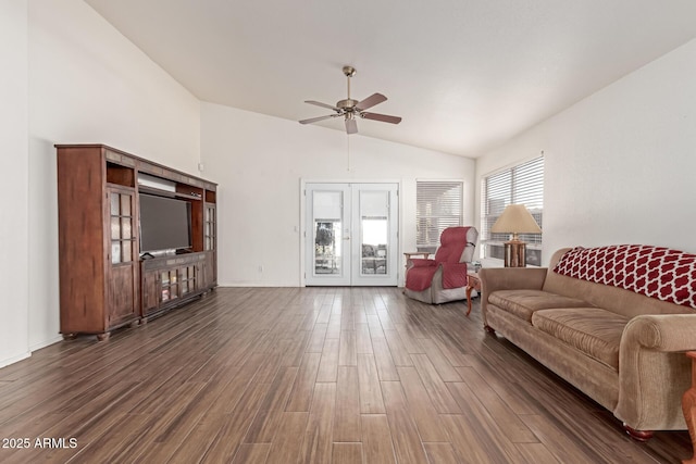 living room with ceiling fan, lofted ceiling, dark hardwood / wood-style flooring, and french doors