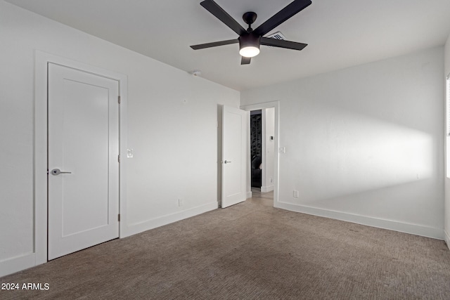 unfurnished bedroom featuring ceiling fan and light colored carpet