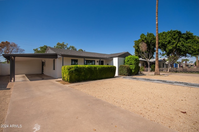 view of front of home featuring a carport