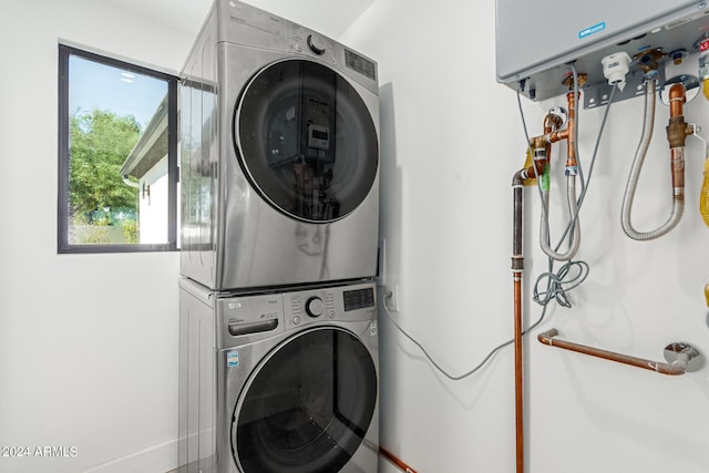 laundry room featuring stacked washer / dryer