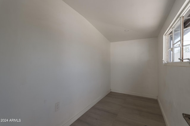 unfurnished room with hardwood / wood-style floors