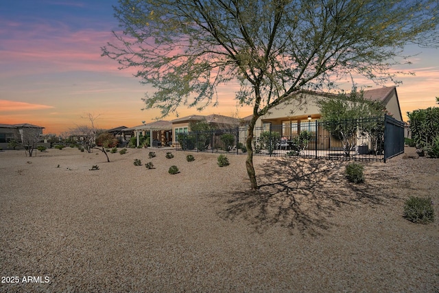 view of yard at dusk