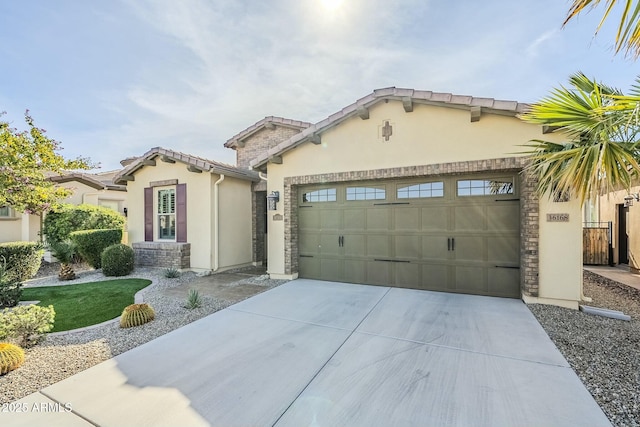 mediterranean / spanish home featuring a garage