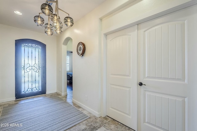 entryway featuring an inviting chandelier