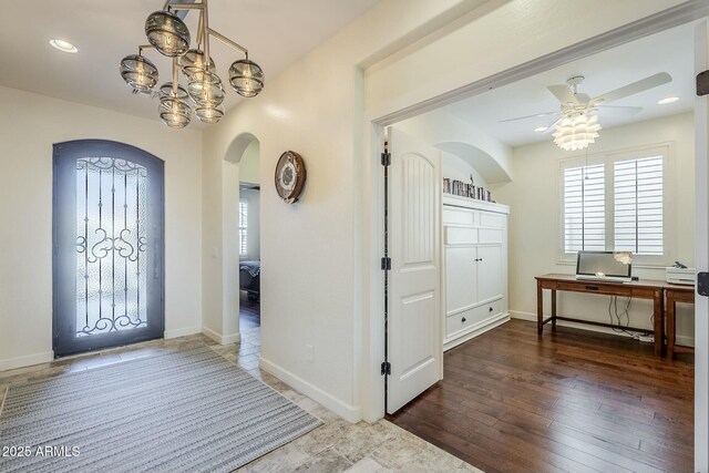 entryway featuring ceiling fan and dark hardwood / wood-style flooring