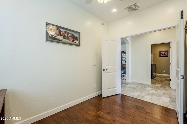 hall with hardwood / wood-style floors