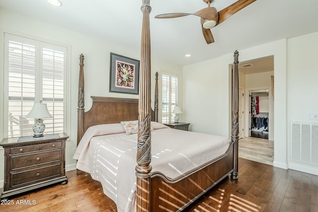 bedroom with hardwood / wood-style floors and ceiling fan