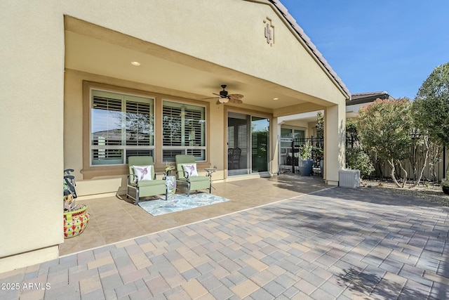 view of patio / terrace featuring ceiling fan