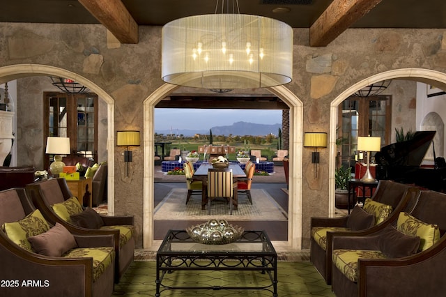 patio terrace at dusk with an outdoor hangout area and a mountain view