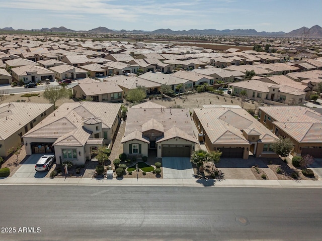 birds eye view of property featuring a mountain view