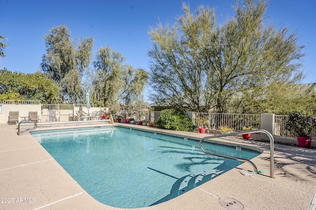 view of swimming pool with a patio