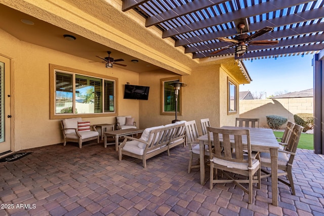 view of patio featuring a pergola, outdoor lounge area, and ceiling fan