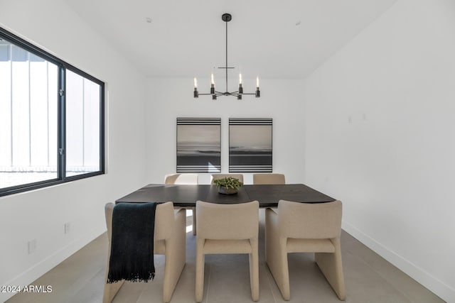 dining room with a notable chandelier