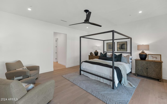 bedroom featuring hardwood / wood-style floors and ceiling fan