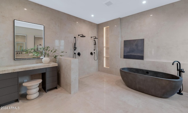 bathroom featuring vanity, shower with separate bathtub, and tile walls