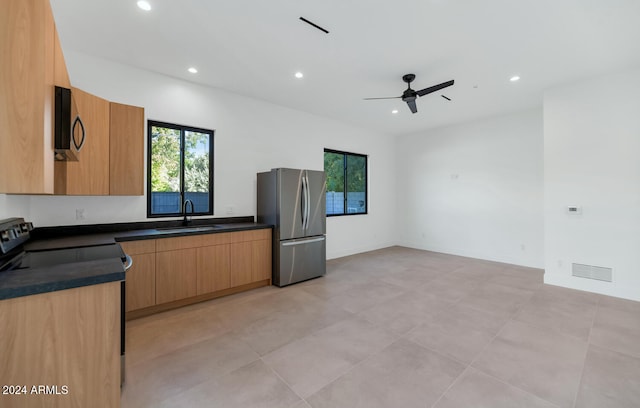 kitchen featuring sink, ceiling fan, and appliances with stainless steel finishes