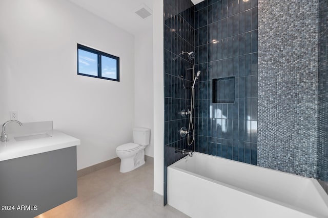 full bathroom featuring tiled shower / bath combo, vanity, and toilet