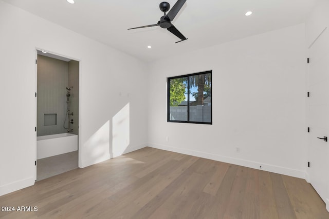 spare room with light hardwood / wood-style floors and ceiling fan