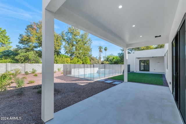 exterior space featuring a fenced in pool