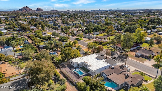 birds eye view of property with a mountain view