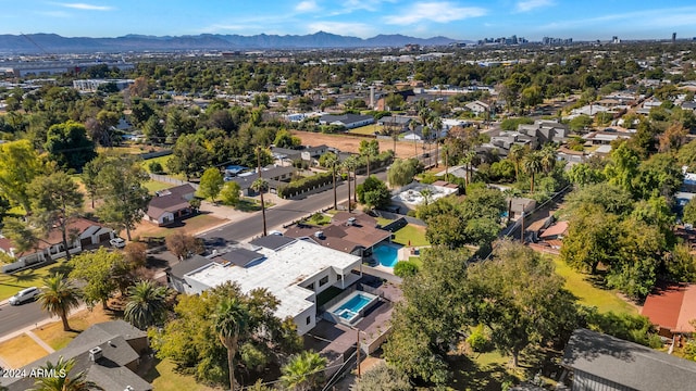 birds eye view of property with a mountain view