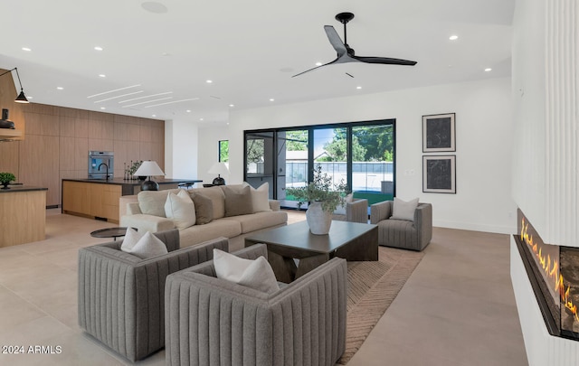 living room with sink and wooden walls