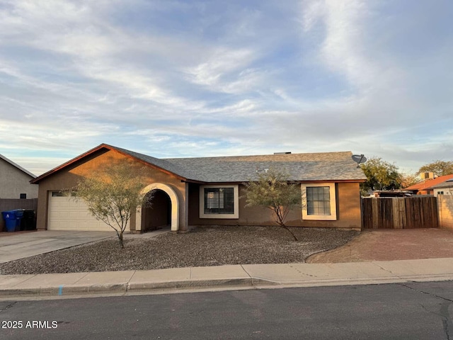 ranch-style house featuring a garage