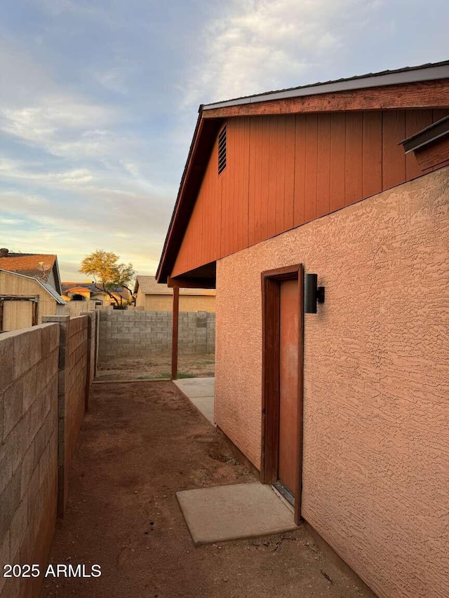 view of property exterior at dusk