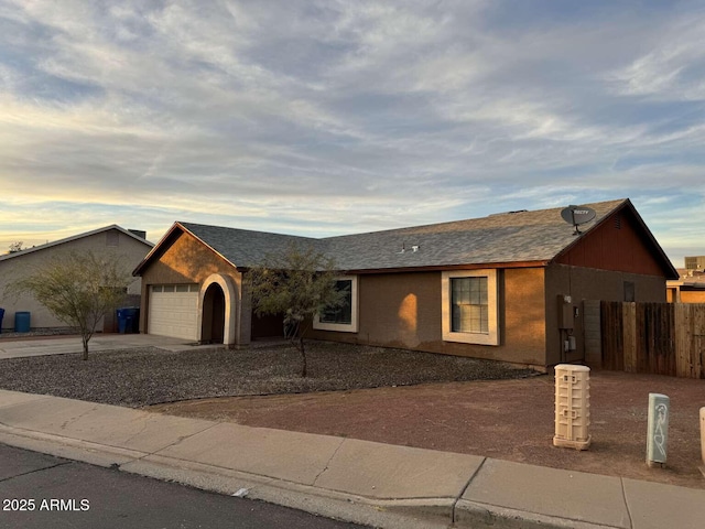 ranch-style home featuring a garage