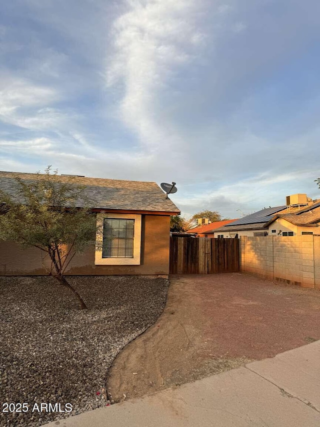 view of property exterior featuring a patio area