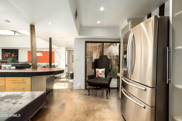4525 N 66th St Unit 112, Scottsdale, AZ 85251 - kitchen with stainless steel fridge with ice dispenser, finished concrete floors, modern cabinets, light brown cabinets, and recessed lighting