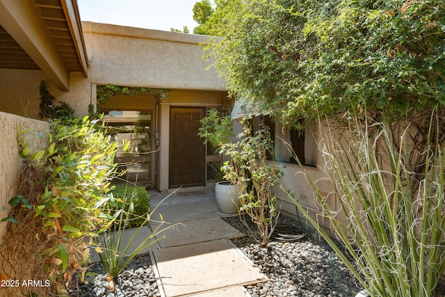 4525 N 66th St Unit 112, Scottsdale, AZ 85251 - view of exterior entry featuring stucco siding