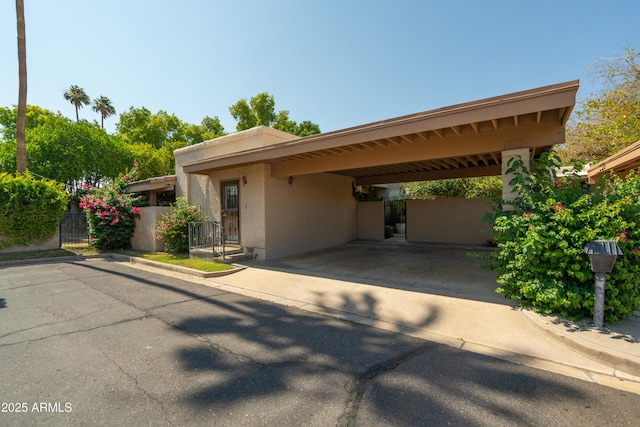 4525 N 66th St Unit 112, Scottsdale, AZ 85251 - view of front of house with stucco siding and an attached carport