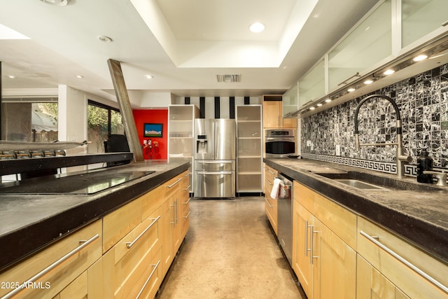 4525 N 66th St Unit 112, Scottsdale, AZ 85251 - kitchen featuring stainless steel appliances, decorative backsplash, light brown cabinetry, and recessed lighting